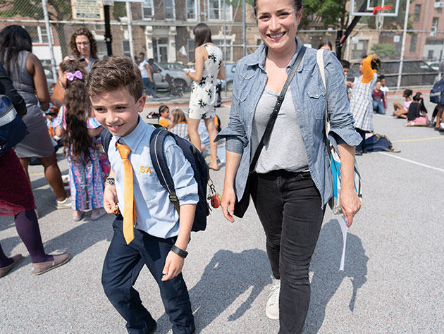 Success Academy events - Parents and scholars in the school yard