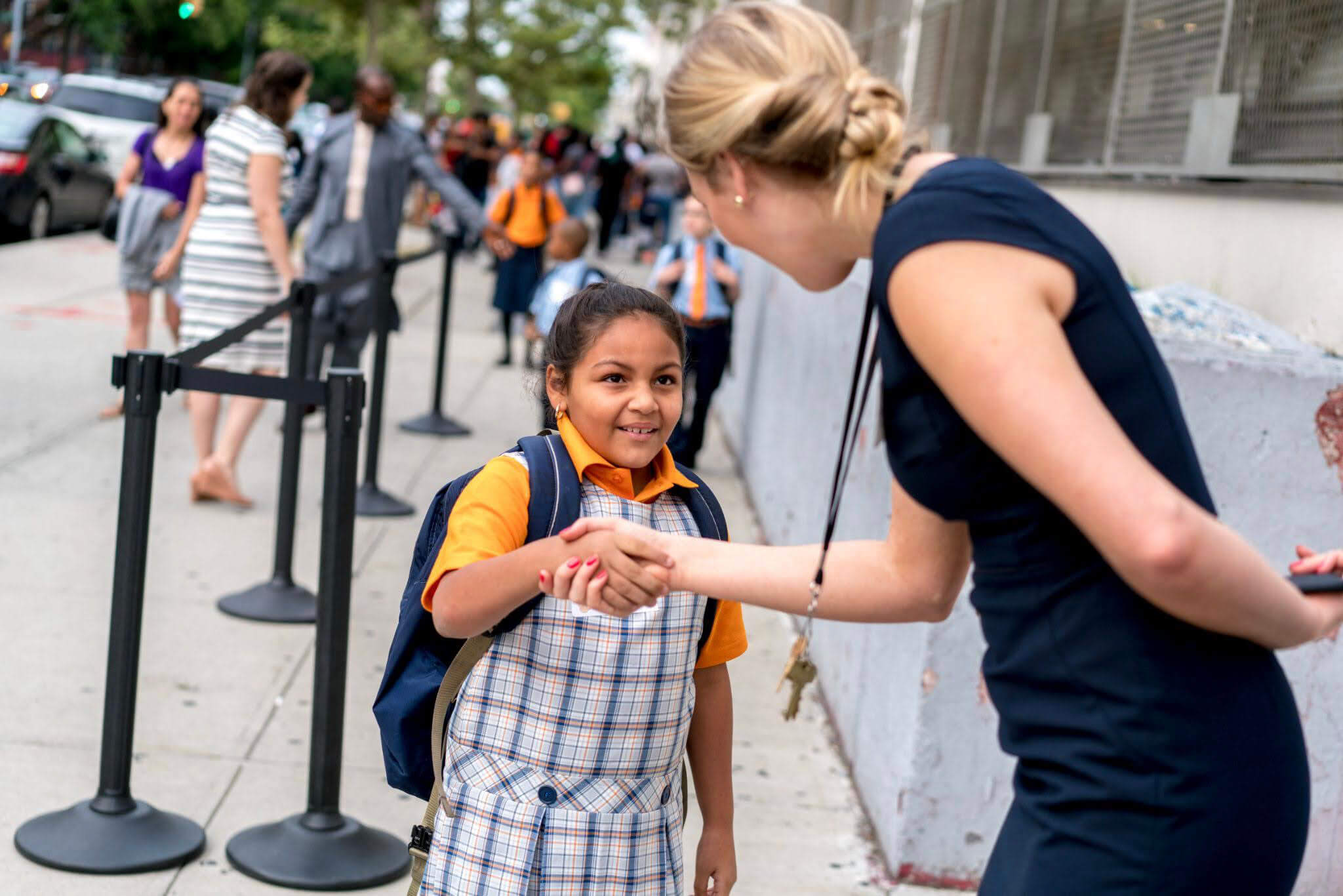 teacher shaking student’s hand